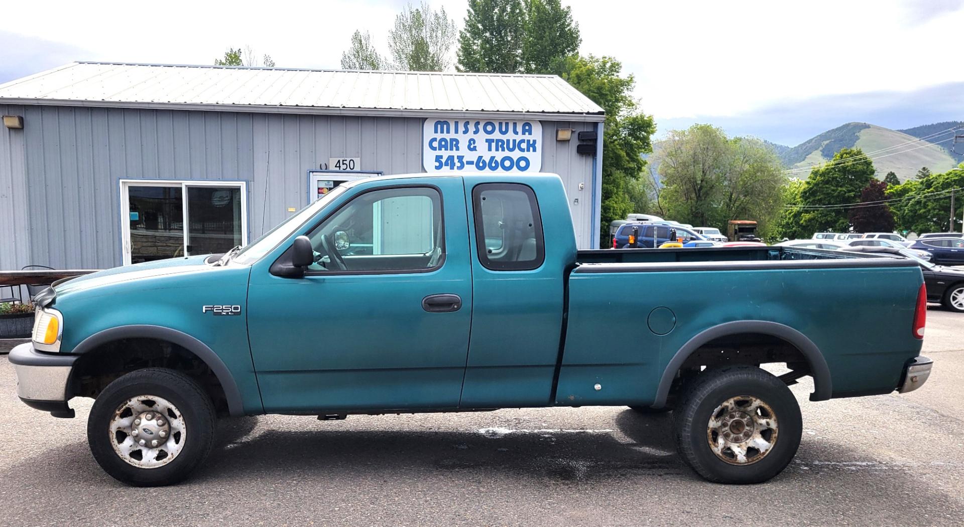 1997 Green /Tan Ford F-250 (1FTFX2866VK) with an 4.6L V8 engine, 4 Speed Manual with Overdrive transmission, located at 450 N Russell, Missoula, MT, 59801, (406) 543-6600, 46.874496, -114.017433 - 4.6L V8 Engine. 4 Speed with Overdrive Manual Transmission. 4 Wheel Drive. 3 Door. Short Box. Air Conditioning. Cruise Control. Financing is NOT Available. - Photo#0